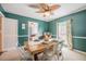 Dining area with a wooden table, seating for six, and a view into the adjacent living room at 4825 Luce Rd, Lakeland, FL 33813