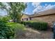 Brick house featuring well-maintained bushes lining the side of the home at 4825 Luce Rd, Lakeland, FL 33813