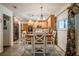 Eat-in kitchen features wooden cabinets, modern appliances, and stylish dining area at 4825 Luce Rd, Lakeland, FL 33813