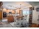 Well-lit kitchen featuring wood cabinets, an island, and an adjacent breakfast nook with seating for four at 4825 Luce Rd, Lakeland, FL 33813