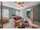 Cozy living room featuring neutral tones, a comfortable sofa, and views into dining area at 4825 Luce Rd, Lakeland, FL 33813