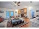 Cozy living room with brick fireplace, hardwood floors, and comfortable seating at 4825 Luce Rd, Lakeland, FL 33813