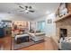 Bright living room featuring hardwood floors, a fireplace, and open access to the kitchen at 4825 Luce Rd, Lakeland, FL 33813