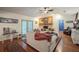 Bright living room featuring hardwood floors, a fireplace, and access to the patio at 4825 Luce Rd, Lakeland, FL 33813