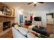 Warm living room with brick fireplace and view of foyer and bedroom at 4825 Luce Rd, Lakeland, FL 33813