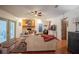 Cozy living room with hardwood floors, brick fireplace and comfortable seating at 4825 Luce Rd, Lakeland, FL 33813