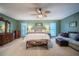 Large main bedroom with sitting area, dresser, and large windows at 4825 Luce Rd, Lakeland, FL 33813