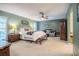 Spacious main bedroom with a sitting area, ceiling fan, and large window at 4825 Luce Rd, Lakeland, FL 33813