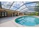 An inviting pool surrounded by a screened enclosure, perfect for relaxation and recreation at 4825 Luce Rd, Lakeland, FL 33813