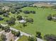 Expansive green pastures surround a home, creating a serene country setting at 511 Hickory Hammock Rd, Lake Wales, FL 33859