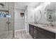 Modern bathroom features double sinks with granite countertops and a tiled shower at 511 Hickory Hammock Rd, Lake Wales, FL 33859