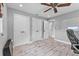 Bedroom features wood-look floors, neutral gray walls and white doors at 511 Hickory Hammock Rd, Lake Wales, FL 33859