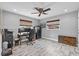 Bedroom with wood-look floors, ceiling fan, and a work-from-home setup at 511 Hickory Hammock Rd, Lake Wales, FL 33859