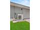 Exterior view of a gray home, showing the AC unit at 511 Hickory Hammock Rd, Lake Wales, FL 33859