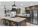 Well-appointed kitchen with a large island, stainless steel appliances, and custom cabinetry at 511 Hickory Hammock Rd, Lake Wales, FL 33859