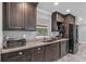 Well-lit kitchen features granite countertops and stainless steel appliances at 511 Hickory Hammock Rd, Lake Wales, FL 33859