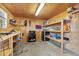 Well-organized workshop with plywood walls, workbenches, and ample storage at 511 Hickory Hammock Rd, Lake Wales, FL 33859