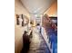 Inviting hallway with wood floors, leading to the living area, showcasing a staircase at 5619 Antler Trl, Lakeland, FL 33811