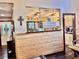 Bright living space with wood paneled half walls and a partial view of a kitchen at 5619 Antler Trl, Lakeland, FL 33811