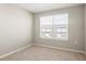 Bedroom featuring a window with natural light and neutral carpet at 5776 Freshwater Canyon Dr, St Cloud, FL 34771