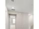 Bright hallway with white walls and stairs leading up to the next level at 5776 Freshwater Canyon Dr, St Cloud, FL 34771