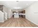 Spacious open-concept living space with kitchen island and stainless steel appliances at 5776 Freshwater Canyon Dr, St Cloud, FL 34771
