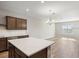 Bright open floor plan with a center island, wood flooring and recessed lighting at 5776 Freshwater Canyon Dr, St Cloud, FL 34771