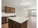 Bright open floor plan with a center island, wood flooring and recessed lighting at 5776 Freshwater Canyon Dr, St Cloud, FL 34771