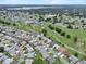 Neighborhood aerial view showing the location of the house next to a golf course and community amenities at 6086 Swallow Dr, Lakeland, FL 33809