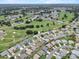 Aerial view showcasing the home's location in a golf course community with nearby amenities at 6086 Swallow Dr, Lakeland, FL 33809