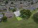 Aerial view of the house and backyard, with lush green lawn at 6086 Swallow Dr, Lakeland, FL 33809
