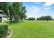 Lush, expansive backyard offering picturesque views of mature trees and green space, providing serene privacy at 6086 Swallow Dr, Lakeland, FL 33809