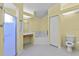 Bright bathroom featuring a shower stall, vanity, toilet, and soaking tub at 6086 Swallow Dr, Lakeland, FL 33809