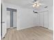 Well-lit bedroom with neutral walls and light wood flooring at 6086 Swallow Dr, Lakeland, FL 33809
