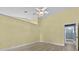 Spacious bedroom with laminate floors, ceiling fan, and ensuite bathroom at 6086 Swallow Dr, Lakeland, FL 33809