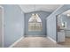 Sunny dining room featuring a modern chandelier and large window at 6086 Swallow Dr, Lakeland, FL 33809