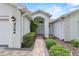 Inviting walkway to a charming front door with beautiful landscaping at 6086 Swallow Dr, Lakeland, FL 33809