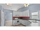 Bright eat-in kitchen features a white refrigerator, modern appliances, and updated cabinets at 6086 Swallow Dr, Lakeland, FL 33809
