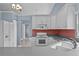 Bright eat-in kitchen features a white refrigerator, updated cabinets, and ample counter space at 6086 Swallow Dr, Lakeland, FL 33809