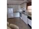 Well-lit kitchen with white cabinetry, black appliances, and plenty of workspace for cooking and storage at 612 Forest Lake Dr, Lakeland, FL 33809