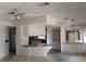 Open-concept living area boasts neutral colors and ample natural light, leading into the kitchen at 612 Forest Lake Dr, Lakeland, FL 33809
