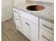 Bathroom vanity features shaker cabinets, granite countertops, and chrome hardware at 625 W 9Th St, Lakeland, FL 33805
