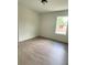 Bedroom featuring luxury vinyl plank flooring and a bright window at 625 W 9Th St, Lakeland, FL 33805