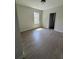 Bright bedroom with wood-look flooring, a window letting in natural light, and a neutral color scheme at 625 W 9Th St, Lakeland, FL 33805