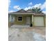 Charming one story home with front porch, vinyl siding and attached one car garage at 625 W 9Th St, Lakeland, FL 33805