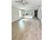 Open-concept living room, kitchen, and dining area featuring vinyl flooring and recessed lighting at 625 W 9Th St, Lakeland, FL 33805