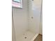 Shower with white subway tile and shower head fixture; marble window sill at 625 W 9Th St, Lakeland, FL 33805