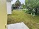 View of a spacious backyard with grass, trees, and room for activities at 629 W 9Th, Lakeland, FL 33805