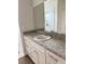Bathroom featuring a vanity with ample countertop space and a shower with white tile at 629 W 9Th, Lakeland, FL 33805