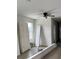 Bedroom showing ceiling fan, interior doors, and flooring at 629 W 9Th, Lakeland, FL 33805